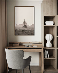 A boat drifting near Es Vedrà, Ibiza, in soft sea haze — fine-art photograph by Kayleigh Groenendijk