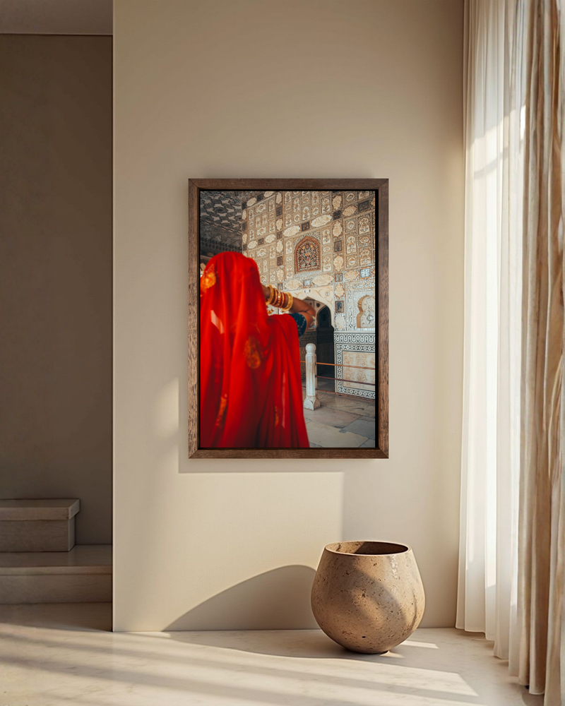 A woman in red stands before a sacred wall in Jaipur India — fine-art photograph by Kayleigh Groenendijk