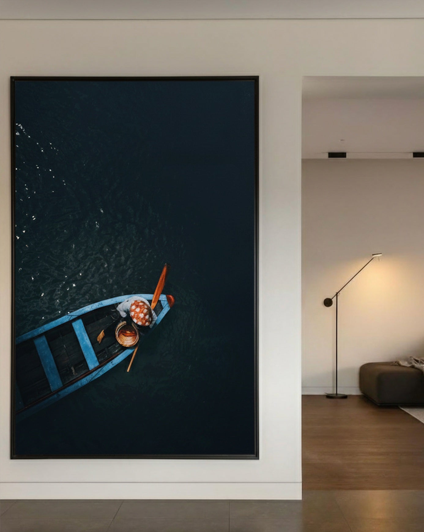 Woman drifting in a small wooden boat on a dark river, Vietnam — fine-art photograph by Kayleigh Groenendijk