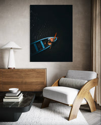 Woman drifting in a small wooden boat on a dark river, Vietnam — fine-art photograph by Kayleigh Groenendijk