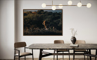 Lion walking through the jungle in evening light — fine-art photograph by Kayleigh Groenendijk