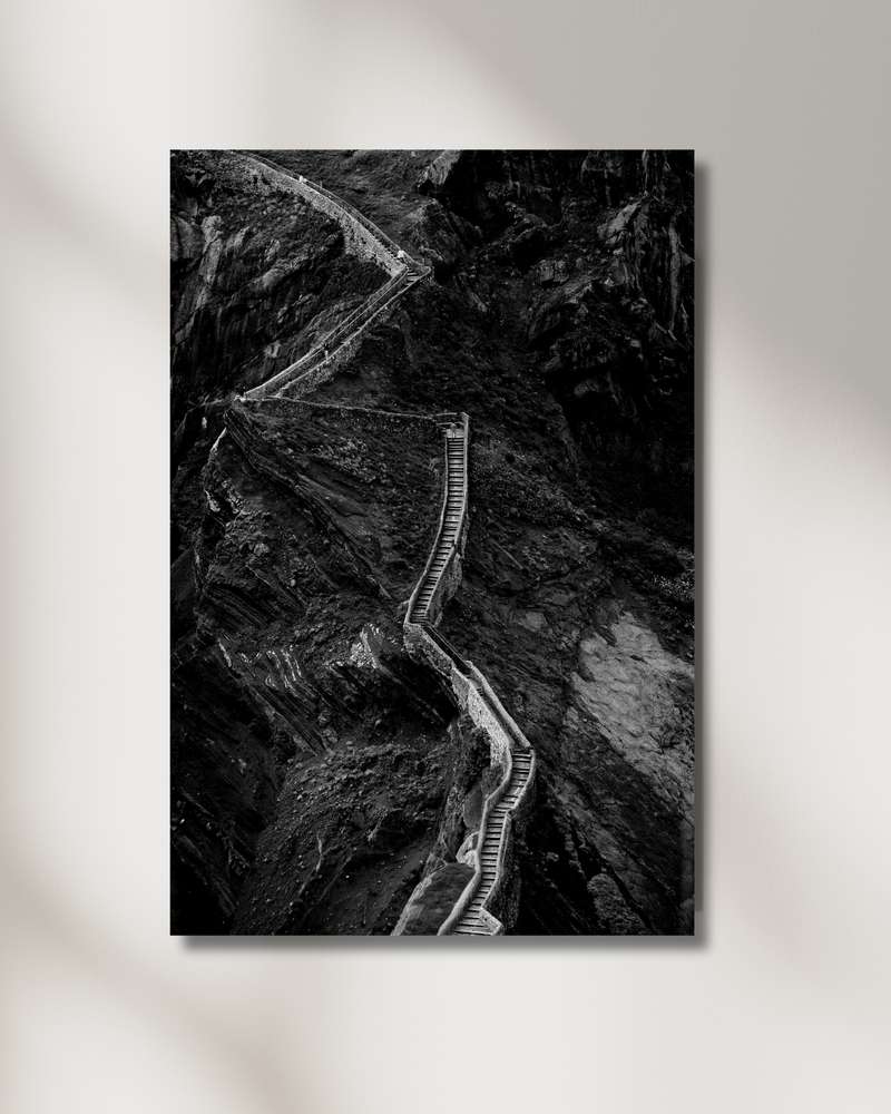 A winding trail carved up a wall of stone at Gaztelugatxe— fine-art photograph by Kayleigh Groenendijk