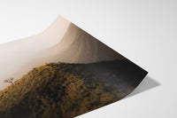 A lone hiker on a misty mountain ridge — fine-art photograph by Kayleigh Groenendijk